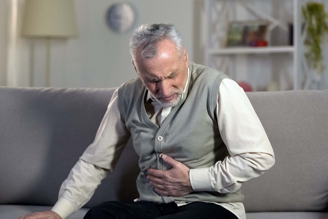Old male having strong abdominal ache, stomach ulcer disease, health problems